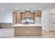Well-lit kitchen with shaker cabinets, white countertops, stainless appliances, and a stylish central island at 11940 Vector Ray Ave, Las Vegas, NV 89138