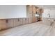 Modern kitchen featuring light wood cabinets, white countertops, and stainless steel appliances, perfect for cooking and entertaining at 11940 Vector Ray Ave, Las Vegas, NV 89138