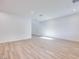 A spacious living room with light hardwood floors, bright white walls, and a minimalist, open layout at 11940 Vector Ray Ave, Las Vegas, NV 89138