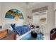 Cozy bedroom features a white twin bed, ceiling fan, and unique decor at 1433 Erskine Ave, Las Vegas, NV 89123