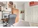 Bright bedroom featuring a workspace, wooden wardrobe and a large closet at 1433 Erskine Ave, Las Vegas, NV 89123