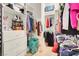 Walk-in closet with built-in shelving, drawers, and ample storage space for clothes at 1433 Erskine Ave, Las Vegas, NV 89123