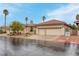 Beautiful single story home featuring desert landscaping, a tile roof, and a two-car garage at 1433 Erskine Ave, Las Vegas, NV 89123