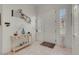 Bright foyer with tile floors, a white front door, and stylish decor at 1433 Erskine Ave, Las Vegas, NV 89123