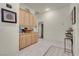 Hallway area featuring light wood cabinets for storage and display space at 1433 Erskine Ave, Las Vegas, NV 89123