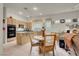 Inviting kitchen space flows into a dining nook, with a view of the kitchen island at 1433 Erskine Ave, Las Vegas, NV 89123