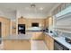 Efficient kitchen with an island, built-in appliances, and functional countertop space at 1433 Erskine Ave, Las Vegas, NV 89123