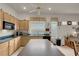 Functional kitchen with a center island, dark countertops, and modern appliances at 1433 Erskine Ave, Las Vegas, NV 89123