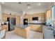 Spacious kitchen offers an island, stainless steel appliances, and plenty of cabinets at 1433 Erskine Ave, Las Vegas, NV 89123