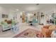 Open-concept living area with dining area and hardwood floors throughout the home at 1433 Erskine Ave, Las Vegas, NV 89123