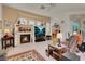 Comfortable living room featuring a fireplace and large windows for natural light at 1433 Erskine Ave, Las Vegas, NV 89123