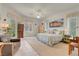 Bright main bedroom with carpet floors, a sitting area and backyard view at 1433 Erskine Ave, Las Vegas, NV 89123