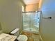 Bathroom featuring a shower with sliding glass doors, toilet and vanity at 1630 Meadow Bluffs Ave, Henderson, NV 89014