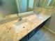 Bathroom vanity featuring dual sinks and a granite countertop at 1630 Meadow Bluffs Ave, Henderson, NV 89014