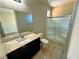 Bathroom with a granite countertop, single sink and glass enclosed shower at 1630 Meadow Bluffs Ave, Henderson, NV 89014