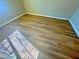 A view of wood flooring with a window offering light into the room at 1630 Meadow Bluffs Ave, Henderson, NV 89014