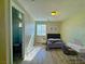 Comfortable bedroom featuring bright natural light, wood flooring, and an adjoining bathroom at 1630 Meadow Bluffs Ave, Henderson, NV 89014