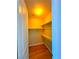 A walk in closet with wood flooring and shelves at 1630 Meadow Bluffs Ave, Henderson, NV 89014