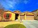 Charming single-story home featuring a two-car garage and desert landscaping at 1630 Meadow Bluffs Ave, Henderson, NV 89014