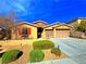 Charming single-story home featuring desert landscaping, a two-car garage, and a cozy front porch at 1630 Meadow Bluffs Ave, Henderson, NV 89014