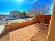 An enclosed front yard with a brick walkway and desert landscaping at 1630 Meadow Bluffs Ave, Henderson, NV 89014
