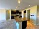 Kitchen with granite-topped island and dark cabinetry at 1630 Meadow Bluffs Ave, Henderson, NV 89014