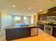 Modern kitchen with granite counters, stainless steel appliances, and an open layout at 1630 Meadow Bluffs Ave, Henderson, NV 89014