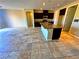 Spacious kitchen with island, stainless appliances and stone tile flooring at 1630 Meadow Bluffs Ave, Henderson, NV 89014
