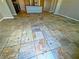 Open living room area has tile flooring, recessed lighting, and neutral colored walls at 1630 Meadow Bluffs Ave, Henderson, NV 89014