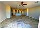 Open living room area has tile flooring, recessed lighting, and neutral colored walls at 1630 Meadow Bluffs Ave, Henderson, NV 89014