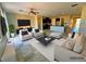 Spacious living room featuring tile floors, modern furniture, and an open layout concept at 1630 Meadow Bluffs Ave, Henderson, NV 89014