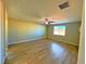 Spacious room features wood floors, neutral walls, and a ceiling fan at 1630 Meadow Bluffs Ave, Henderson, NV 89014