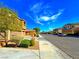 Street view of a residential neighborhood with well-maintained homes, landscaping, and sidewalks at 1630 Meadow Bluffs Ave, Henderson, NV 89014