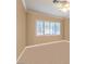 The empty bedroom features beige carpet, neutral walls, and a large shuttered window at 258 Spring River Ave, Las Vegas, NV 89123