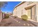 Inviting entrance way to the home features desert landscaping and a private courtyard at 258 Spring River Ave, Las Vegas, NV 89123