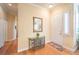 Foyer with natural light, hardwood floors, neutral paint and convenient coat closet at 258 Spring River Ave, Las Vegas, NV 89123