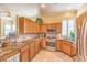 This kitchen features granite counters, stainless steel appliances, and ample cabinet space at 258 Spring River Ave, Las Vegas, NV 89123