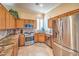 This kitchen boasts stainless steel appliances, granite countertops, and wooden cabinets at 258 Spring River Ave, Las Vegas, NV 89123