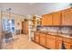 This kitchen has wooden cabinets, granite countertops, a breakfast nook, and yard access at 258 Spring River Ave, Las Vegas, NV 89123