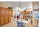 A spacious kitchen with stainless steel appliances opens to a living area at 258 Spring River Ave, Las Vegas, NV 89123