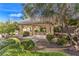 A shaded pavilion with stone pillars, table, and landscaped surroundings provides a relaxing outdoor space at 258 Spring River Ave, Las Vegas, NV 89123