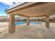 Covered patio overlooking a sparkling community pool with ample space for lounging and recreation at 258 Spring River Ave, Las Vegas, NV 89123