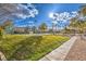 View of community tennis courts with green space and trees, for active lifestyles and relaxation at 258 Spring River Ave, Las Vegas, NV 89123