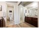 Bathroom featuring a granite countertop, separate toilet room and an enclosed mirror door closet at 2606 S Durango Dr # 152, Las Vegas, NV 89117