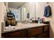 Bathroom features a granite countertop, modern fixtures, and ample storage space at 2606 S Durango Dr # 152, Las Vegas, NV 89117