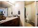Bathroom with a large countertop, sink, mirror, and separated toilet area at 2606 S Durango Dr # 152, Las Vegas, NV 89117