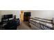 Bedroom with a bed, carpeted floor, and a gaming setup at 2606 S Durango Dr # 152, Las Vegas, NV 89117