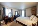 Bedroom featuring large windows, a bed, and dark furnishings at 2606 S Durango Dr # 152, Las Vegas, NV 89117