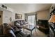 Inviting living room with a large window, comfortable leather seating, and modern entertainment center for relaxation at 2606 S Durango Dr # 152, Las Vegas, NV 89117