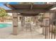 Outdoor seating area with covered structure overlooking pool at 2606 S Durango Dr # 152, Las Vegas, NV 89117